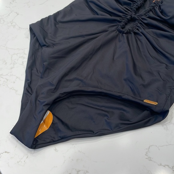 Palmacea, one piece, tied swimsuit with cut outs.  
Size M - Picture 3 of 12